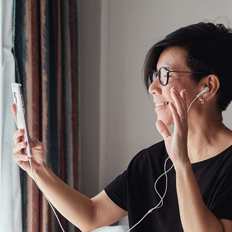 Woman connecting to video conferencing call on her phone